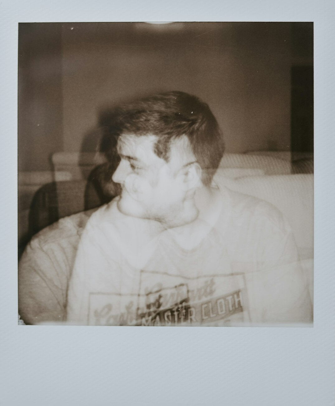 Portrait of a man in his late thirties with a short beard in a neutral studio